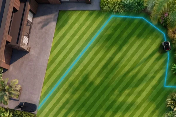 Aerial lawn view with glowing blue boundary line guiding robotic mower along mapped edge.