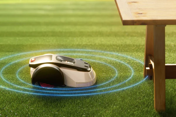 Robotic mower senses wooden bench, blue rings show obstacle detection and avoidance.